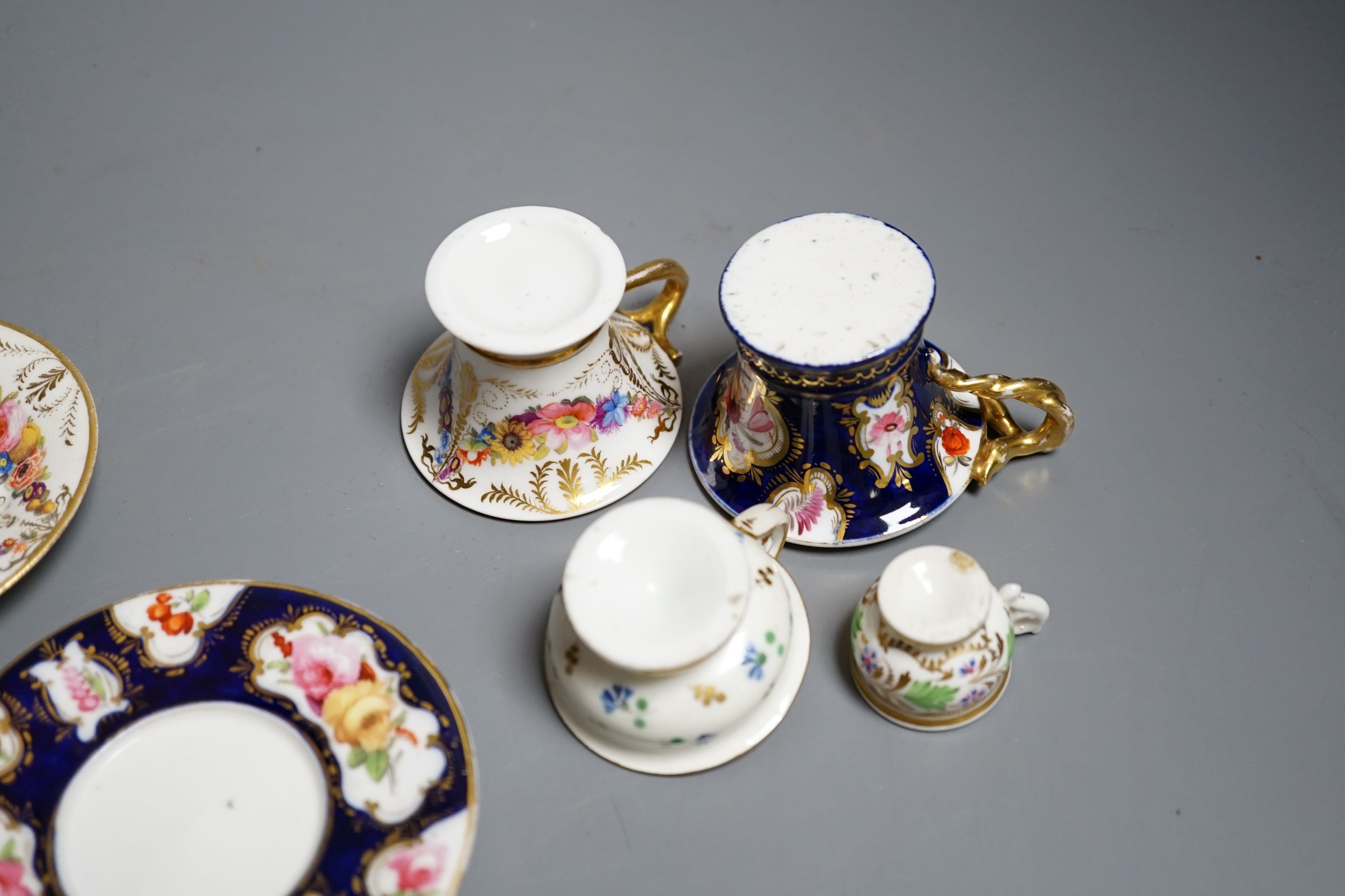 Four Coalport miniature teacups and saucers, c. 1820. Provenance - Mona Sattin collection of miniature cups and saucers, collection no.s 102, 103, 104 and 106.